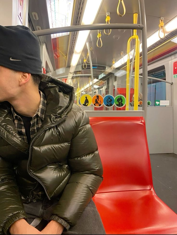 Dark puffer jacket subway